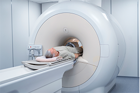 Old-age man under the process of MRI Scan